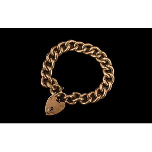 20 - Antique Period 9ct Gold Curb Bracelet with attached large 9ct gold heart shaped padlock. All links m... 