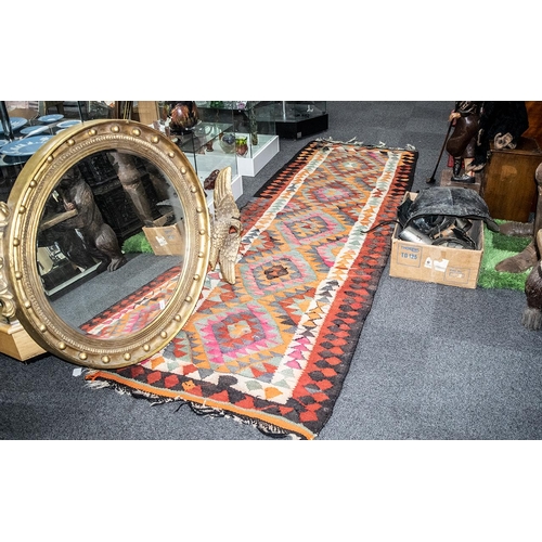 1081 - Large Turkish Kelim Tribal Weave Carpet with a coloured geometric design, 11 feet (330cms) x 3.5 fee... 