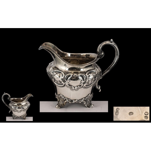 116 - Early Victorian Ornate Embossed Silver Milk Jug of small proportions with swan necked handle gilt in... 