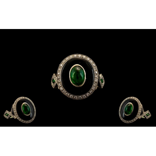 17A - 18ct white Gold Deco Style Ring, central cabochon cut Emerald in a black Onyx mount with diamond set... 