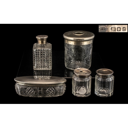 170 - Collection of Silver Topped Glass Jars.  Five items in total, fully hallmarked, largest being 9.5 cm... 