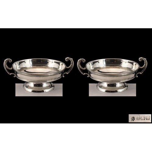 133 - Pair of Matching Silver Twin Handled Bowls dated Birmingham 1912.  Lovely design.  Please see accomp... 