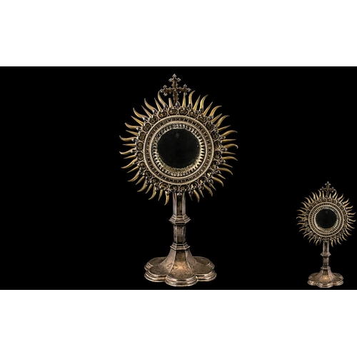 262 - Antique Silvered Metal Ecclesiastical Monstrance of radiating sun burst form, with a glass hinged do... 