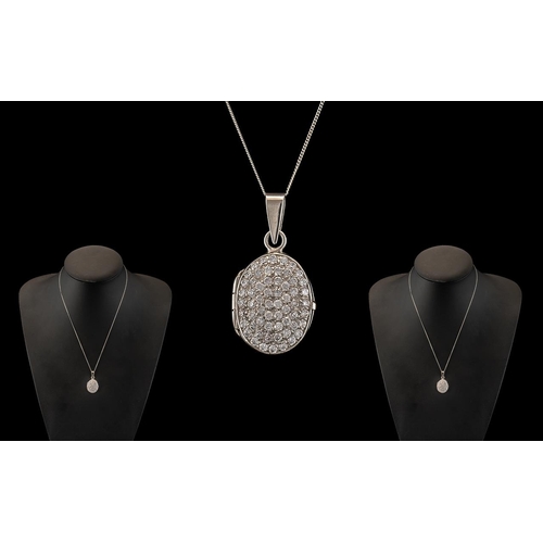 80 - A Contemporary and Attractive 9ct White Gold CZ Set Hinged Locket with Attached 9ct Gold Chain. Both... 