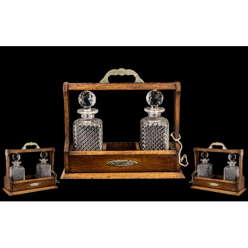 1124 - Tantalus Early 20th Century.  Oak and silver plate Tantalus, comes with key, side locking.  Please s... 