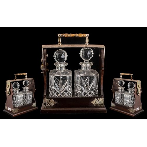 1125 - Tantalus made by Maplin & Webb.  Silver plate and wooden Tantalus, made by Maplin & Webb, named 'The... 