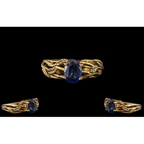 167 - Unisex Sapphire 9ct Gold Dress Ring set with vibrant and lovely blue stone with leaf decoration to s... 