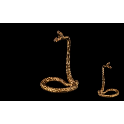 169 - A Cast Novelty Watch Stand in the form of a Snake.  Cast snake watch stand/holder, realistically det... 