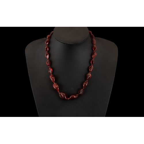 173 - Cherry Amber/ Balelite Coloured Necklace.  Amber necklace in natural form and in graduating style, d... 