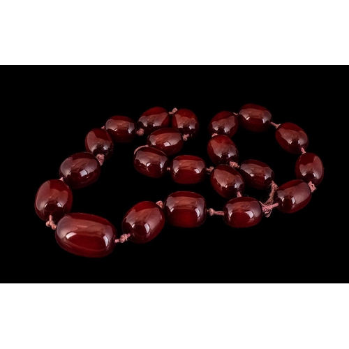 179A - An Amber Coloured Cherry Bead Necklace - Individually knotted, Length 30 Inches.