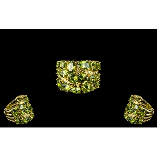 139 - Peridot High Carat Cluster Statement Ring, 12cts of oval, pear, marquise and round cut peridots set ... 