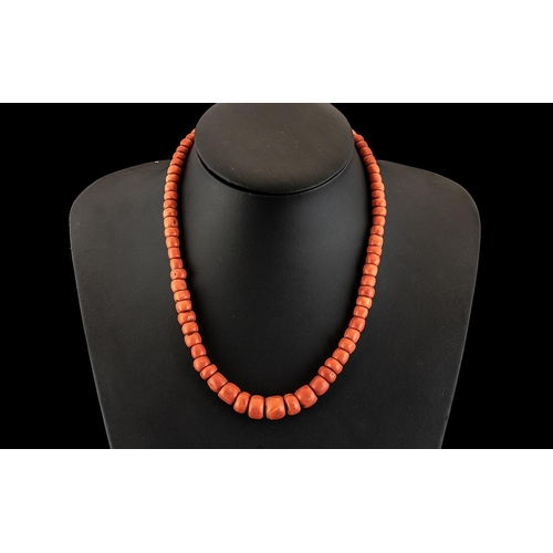 184A - Early 20th Century Mediterranean Pink Coral Necklace, of graduating beads, fastening with a silver c... 