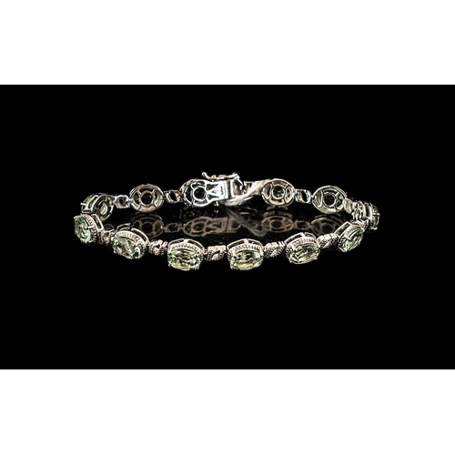 270 - Green Amethyst Tennis Bracelet, 12 oval cut sparkling, mint green amethysts, also called prasiolite,... 