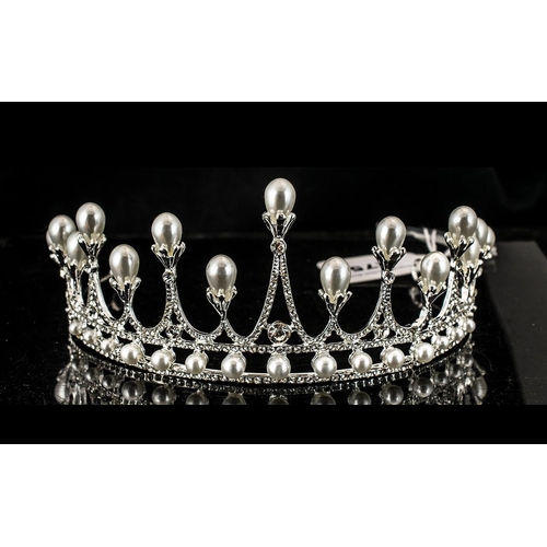 275 - Crystal and White Faux Pearl Tiara, an elegant creation set with white crystals to the 'spikes', eac... 