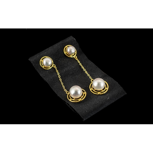 285 - Cultured Pearl Long Drop Earrings, single fresh water white pearls set within circular, open frames ... 