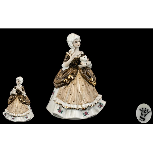 509 - Spode Porcelain Figurine depicting a lady holding a cat, dressed in traditional robes.  Measures 7''... 