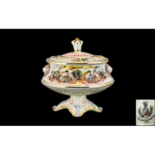 510 - Capodimonte Oval Lidded Bowl, raised on pedestal, decorated with cherubs, lions and floral design.  ... 