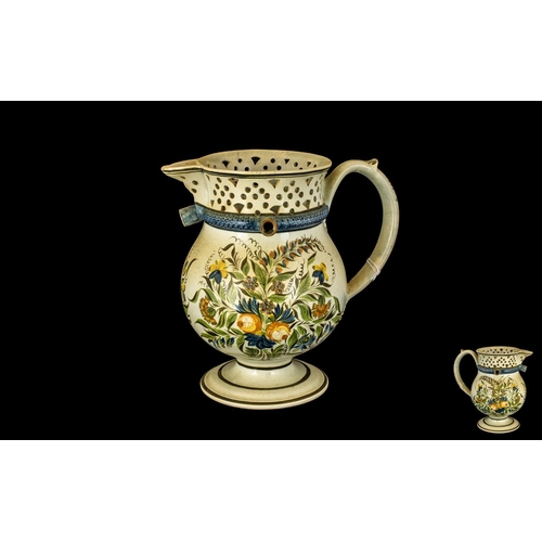 593 - Staffordshire Puzzle Jug in cream with handpainted floral decoration, (some damage to neck).