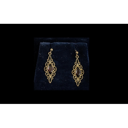 91A - 9ct Gold Ruby/Garnet Set Earrings, large drops of ornate, fancy design, very attractive and of good ... 