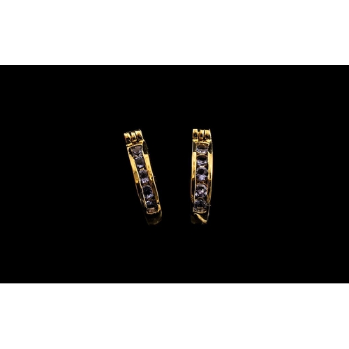 202 - Yellow Diamond J-Hoop Earrings, baguette cut yellow diamonds, channel set down the front of the j-ho... 