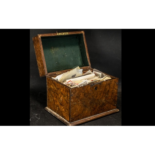 1497 - An Antique Walnut Hinged Box containing a small quantity of stamps to include First Day Covers, odd ... 