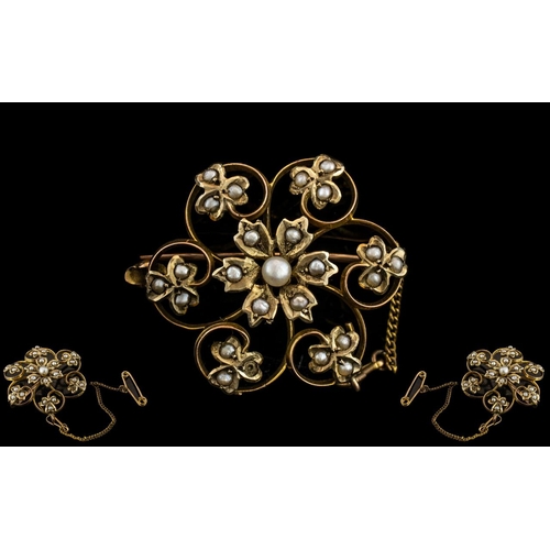 153 - Victorian Period Attractive 9ct Gold Open worked Seed Pearl Set Brooch with Safety Chain. Marked 9ct... 