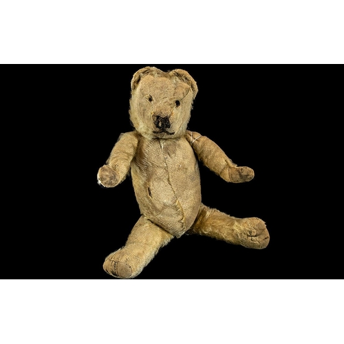 1396 - Early 20th Century Straw Filled Jointed Teddy Bear, with Merrythought tag to foot.