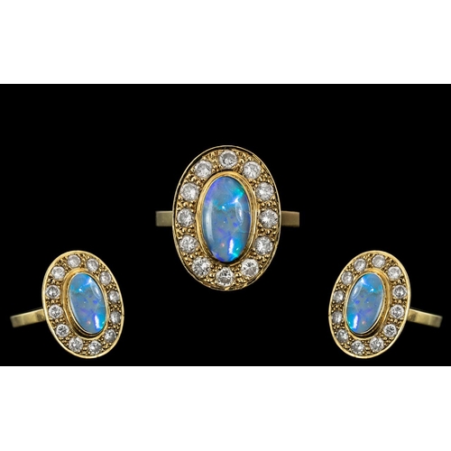 41 - 18ct Gold - Stunning Black Opal and Diamond Set Dress Ring. The Oval Shaped Black Opal of Top Qualit... 