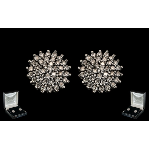 50 - 18ct White Gold Attractive Pair of Diamond Set Cluster Earrings of Circular Form. Marked 18ct - 750.... 