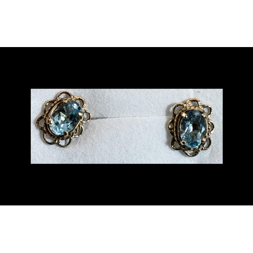 64A - Aquamarine Solitaire Stud Earrings set in 9ct gold scalloped frames with post and push back fittings... 