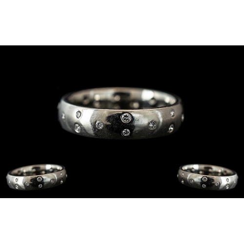 135A - A Platinum Diamond Set Wedding/Eternity Ring,  set with  23  round modern brilliant cut diamonds, fu... 