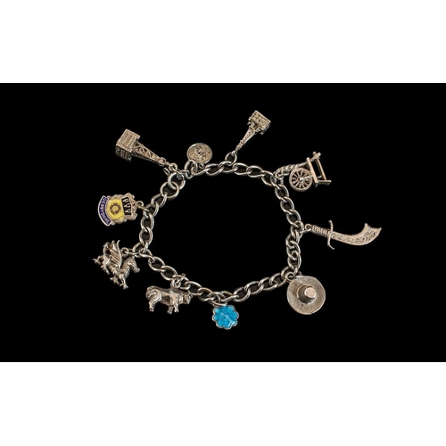 161A - Excellent Sterling Silver Charm Bracelet Loaded with (10) Charms comprising Persian dagger, Blackpoo... 