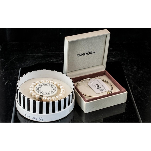 188 - A Pandora Jewellery Silver Bangle in fitted box together with a Thomas Sabo charm club bracelet in f... 