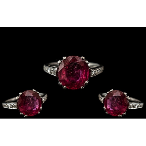 24 - 18ct White Gold - Good Quality Ruby and Diamond Set Ring, The Central Large Natural Faceted Ruby of ... 