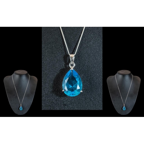 253 - A Pear Shaped Large Blue Topaz Pendant Set in Silver. Blue Topaz pendant 15 carats, in pear shape se... 