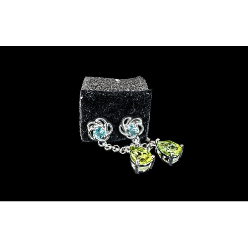 137A - Aquamarine and Peridot Drop Earrings, each having a pear cut peridot suspended, on a fine chain, fro... 