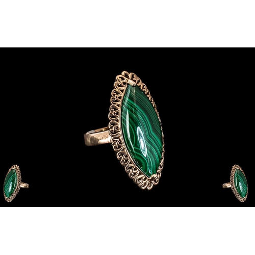 248A - Marquise Cut Malachite Cabochon Statement Ring, 20cts in one marquise cut, natural malachite, an ele... 