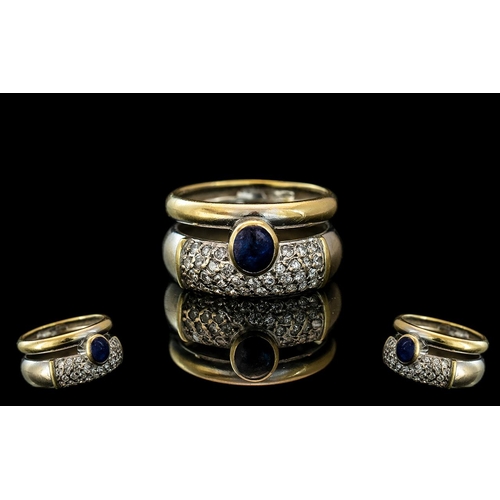 266 - 18ct Gold Bespoke Diamond and Sapphire Set Designer Ring, the cabochon cut sapphire of excellent col... 