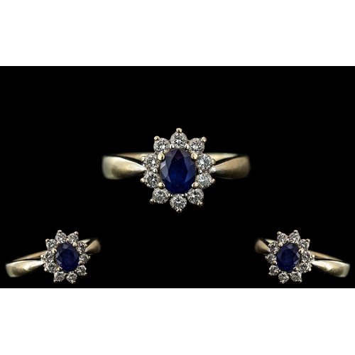 273 - 18ct Gold Attractive and Petite Diamond and Sapphire Set Ring, flower head setting with central face... 