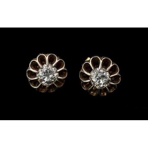 278 - A Fine Pair of Diamond Set Stud Earrings In 18ct Gold, Flower head Design. Marked 750. The Round Sem... 