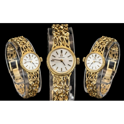 49 - Omega - Elegant Ladies 9ct Gold Wrist Watch, With Integral Open worked Design 9ct Gold Bracelet. In ... 