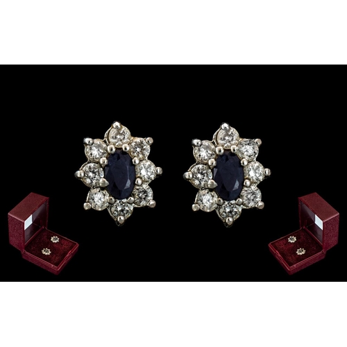 74 - Ladies Fine Pair of 18ct Gold Pair of Sapphire and Diamond Set Earrings. Marked 18ct - 750. Flower h... 