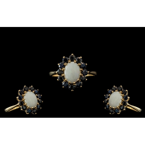 92 - Ladies 9ct Gold Attractive Opal and Sapphire Set Dress Ring, Flower head Design. The Central Opal Su... 