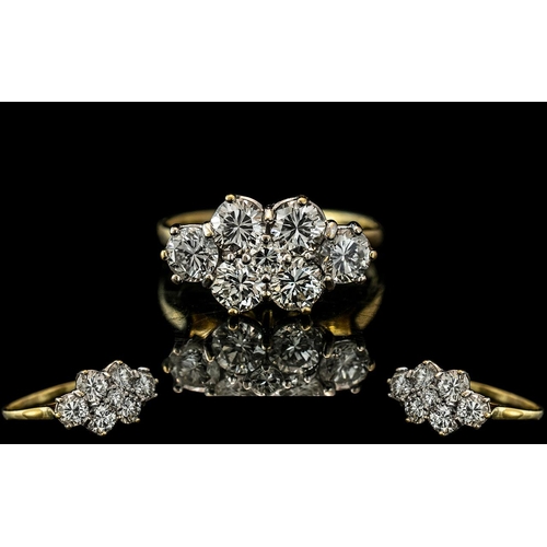 2 - A Diamond Cluster Ring set with six round cut diamonds, approx 30 pts each, and a centre diamond app... 