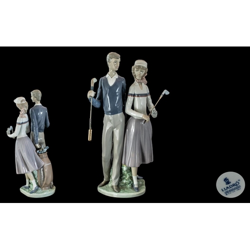 411 - Lladro Hand Painted Porcelain Figure ' Golfing Couple ' Model No 1453. Issued 1983 - Retired. Height... 