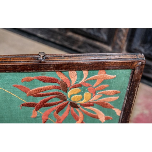 1090C - A Georgian Mahogany Fire Screen with Later Art Nouveau Embroidery Panels.