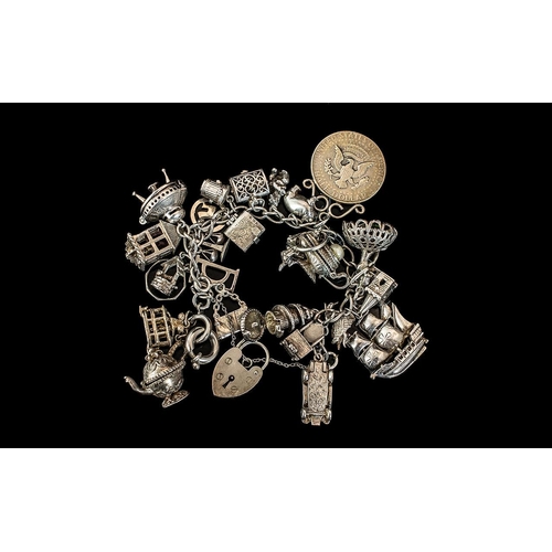 125 - A Superb Vintage Sterling Silver Charm Bracelet Loaded with Over 20 Silver Charms. All Marked for St... 