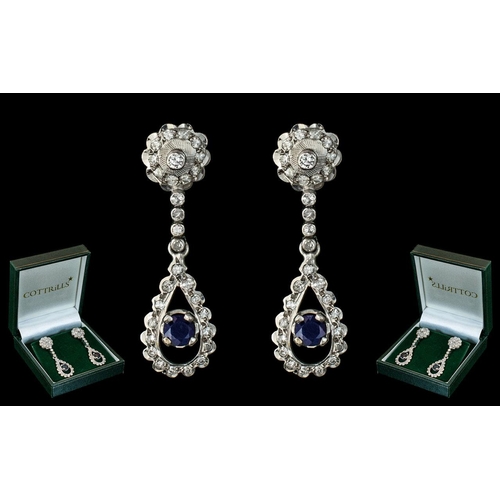 12A - 18ct White Gold - Pleasing and Attractive Diamond and Sapphire Set Pair of Drop Earrings. The Diamon... 