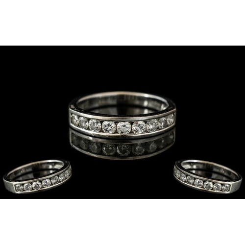 196A - 18ct White Gold Diamond Half Eternity Ring, channel set with nine brilliant cut diamonds. Weight .75... 