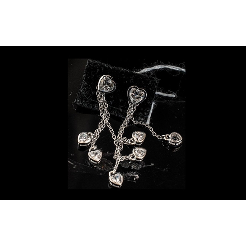 255 - Swarovski Zirconia Set Triple Drop Earrings, each earring comprising three bezel set, heart cut, Swa... 